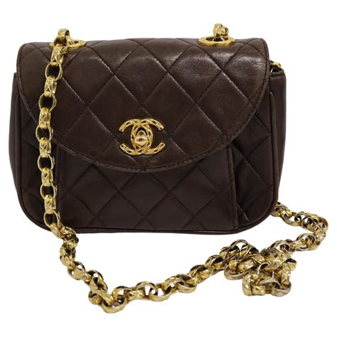 1990s chanel quilted mini square flap tassel|90s Chanel bag.